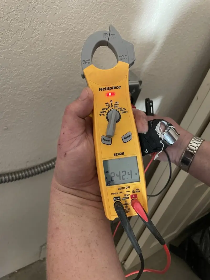 Voltage testing with clamp meter during Electrical Installation Services in Cedar Creek